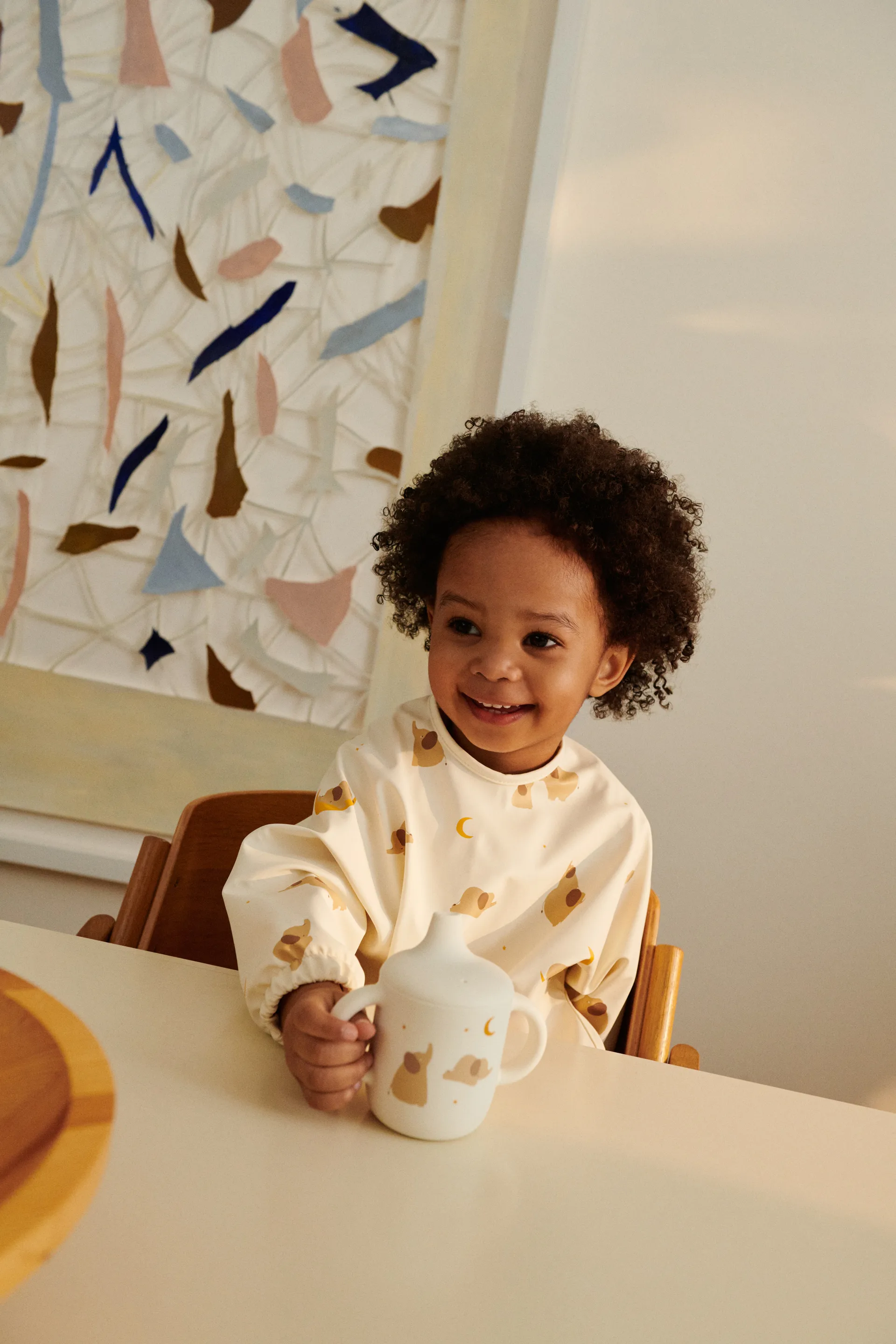 Śliniak z rękawami Merle, Elephant-Creme de la creme Liewood