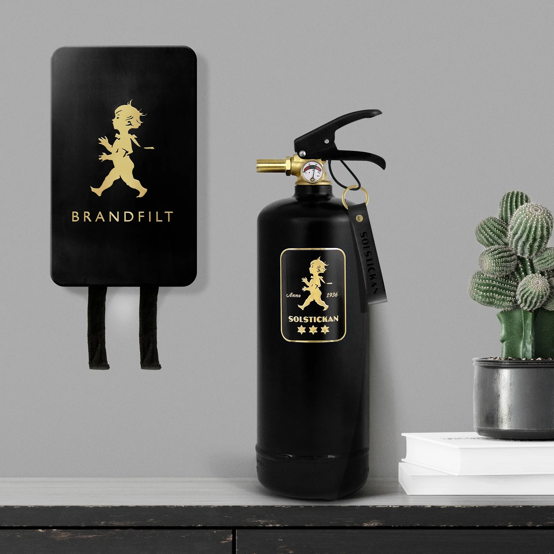 Gaśnica Solstickan 2 kg, Czarny-złoty Solstickan Design