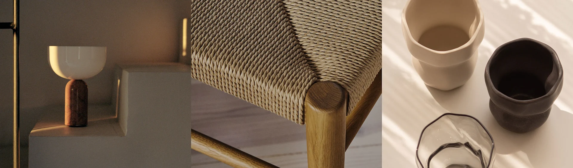 Nowoczesna lampa, plecione siedzisko krzesła i dwa ceramiczne kubki ze szklaną miską, wszystko w ciepłych odcieniach.