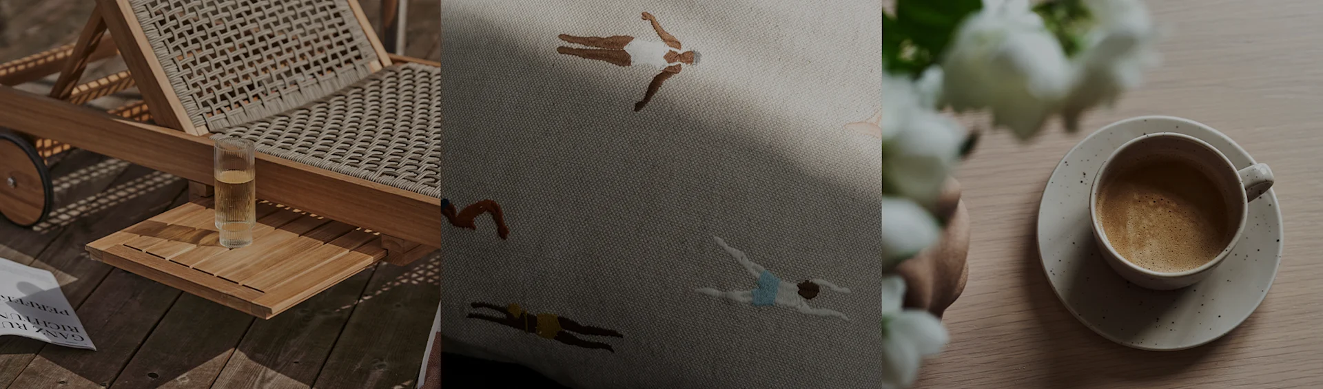 Leżak z napojem, haftowana poduszka z pływakami i filiżanka kawy z białymi kwiatami.